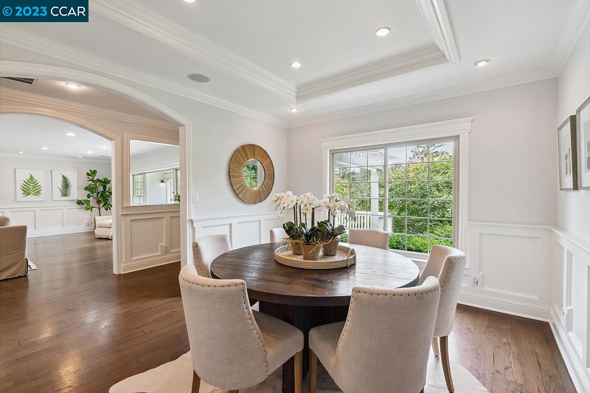Undisclosed Address Orinda, CA 94563 - Photo 13 of 53 a dining room with furniture a window and wooden floor