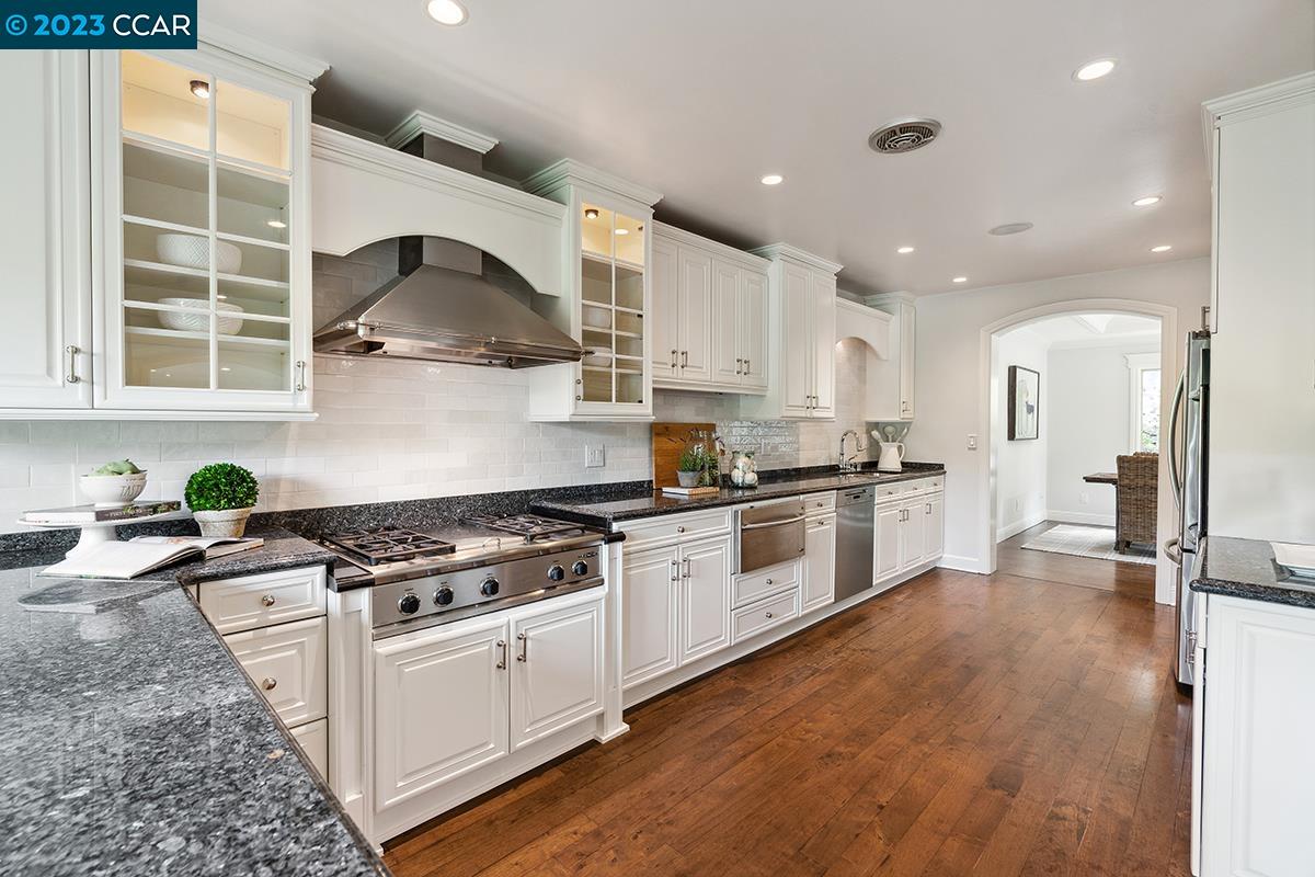 Undisclosed Address Orinda, CA 94563 - Photo 15 of 53 a kitchen with stainless steel appliances granite countertop a stove a sink and a refrigerator
