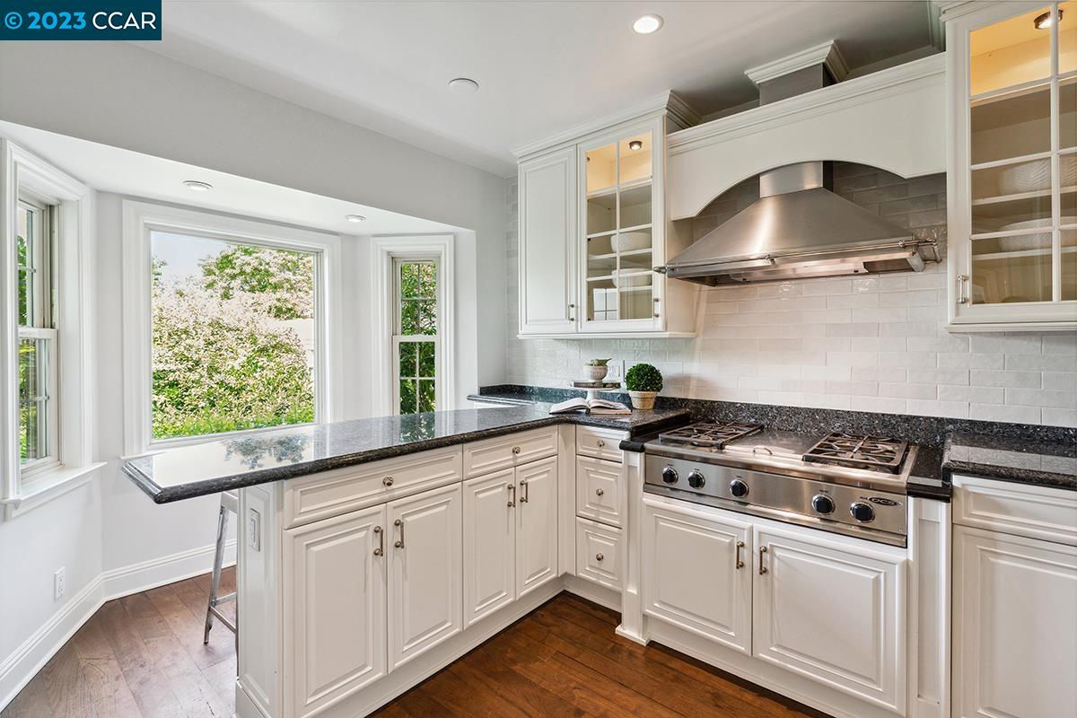 Undisclosed Address Orinda, CA 94563 - Photo 16 of 53 a white kitchen with stainless steel appliances granite countertop a stove and a sink
