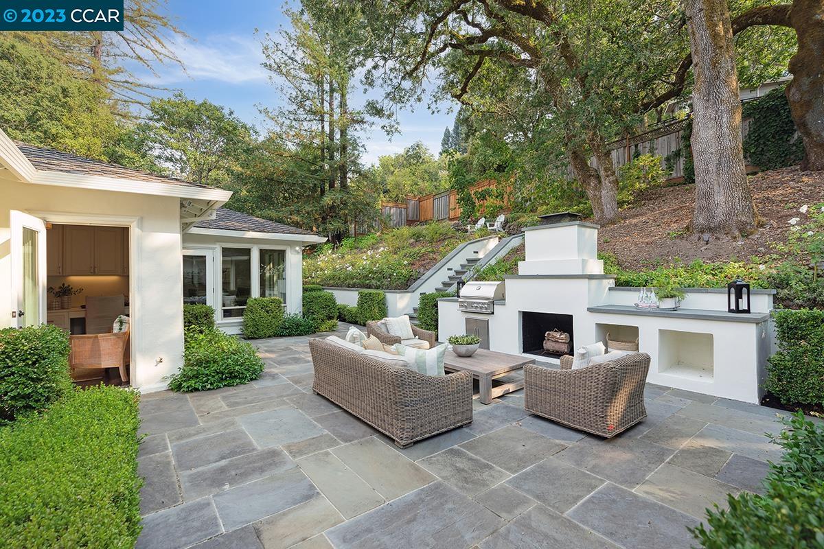 Undisclosed Address Orinda, CA 94563 - Photo 20 of 53 a view of a house with couches chairs and a yard