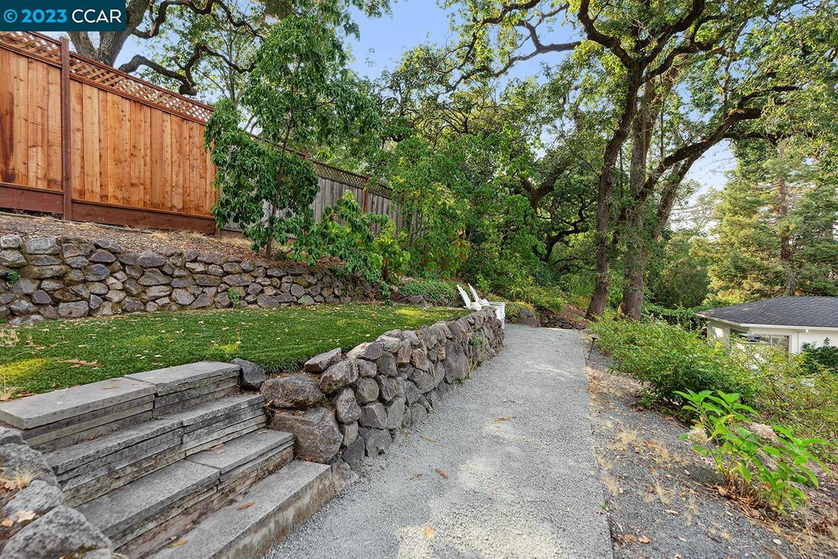 Undisclosed Address Orinda, CA 94563 - Photo 22 of 53 a view of a yard with a house