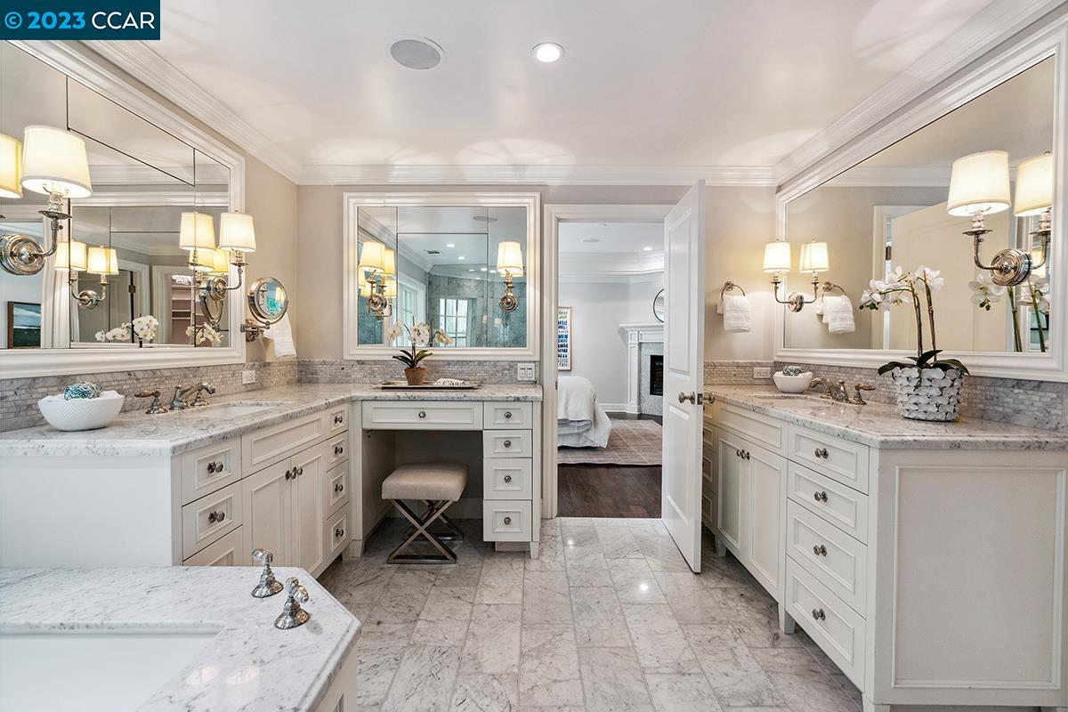 Undisclosed Address Orinda, CA 94563 - Photo 28 of 53 a spacious bathroom with a granite countertop sink mirror and a