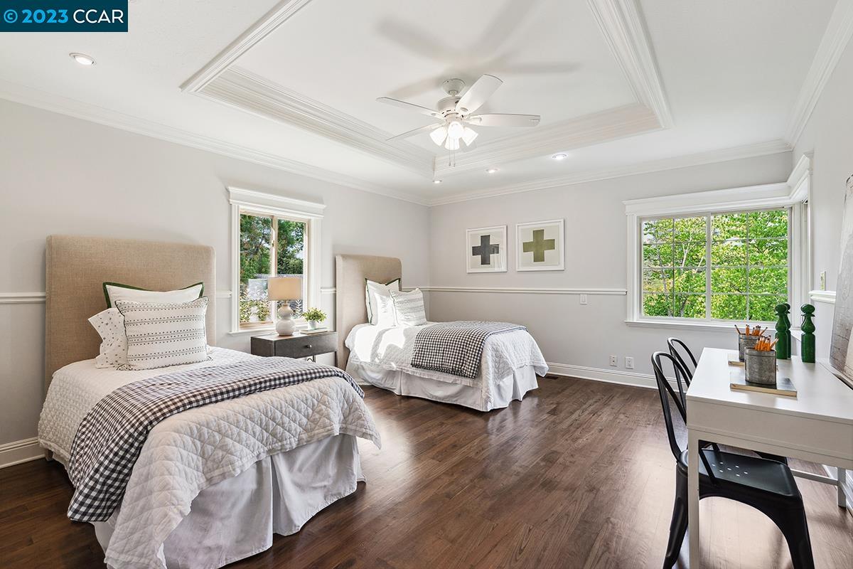 Undisclosed Address Orinda, CA 94563 - Photo 32 of 53 a bedroom with a bed and a chandelier