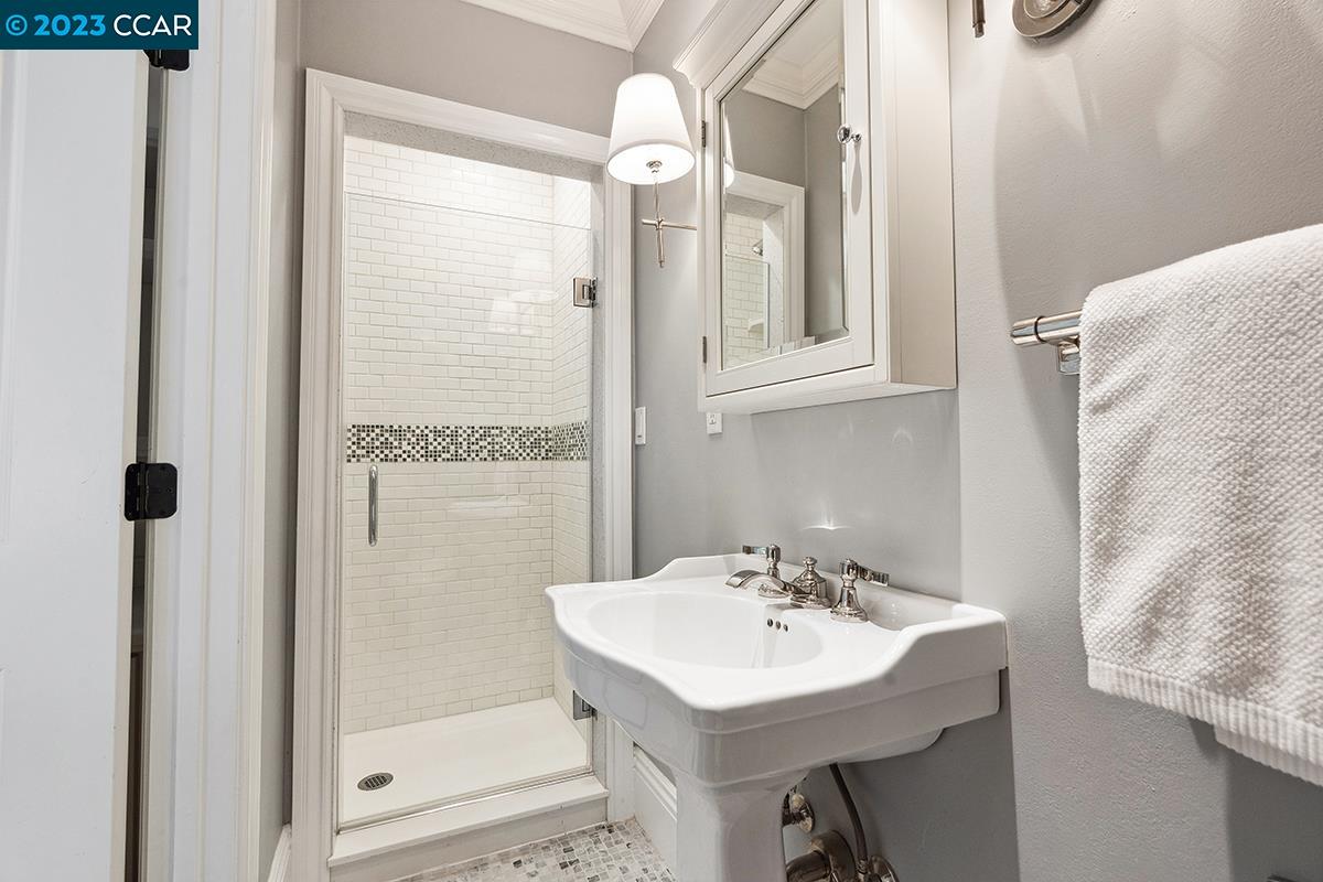 Undisclosed Address Orinda, CA 94563 - Photo 38 of 53 a bathroom with a sink a mirror and shower