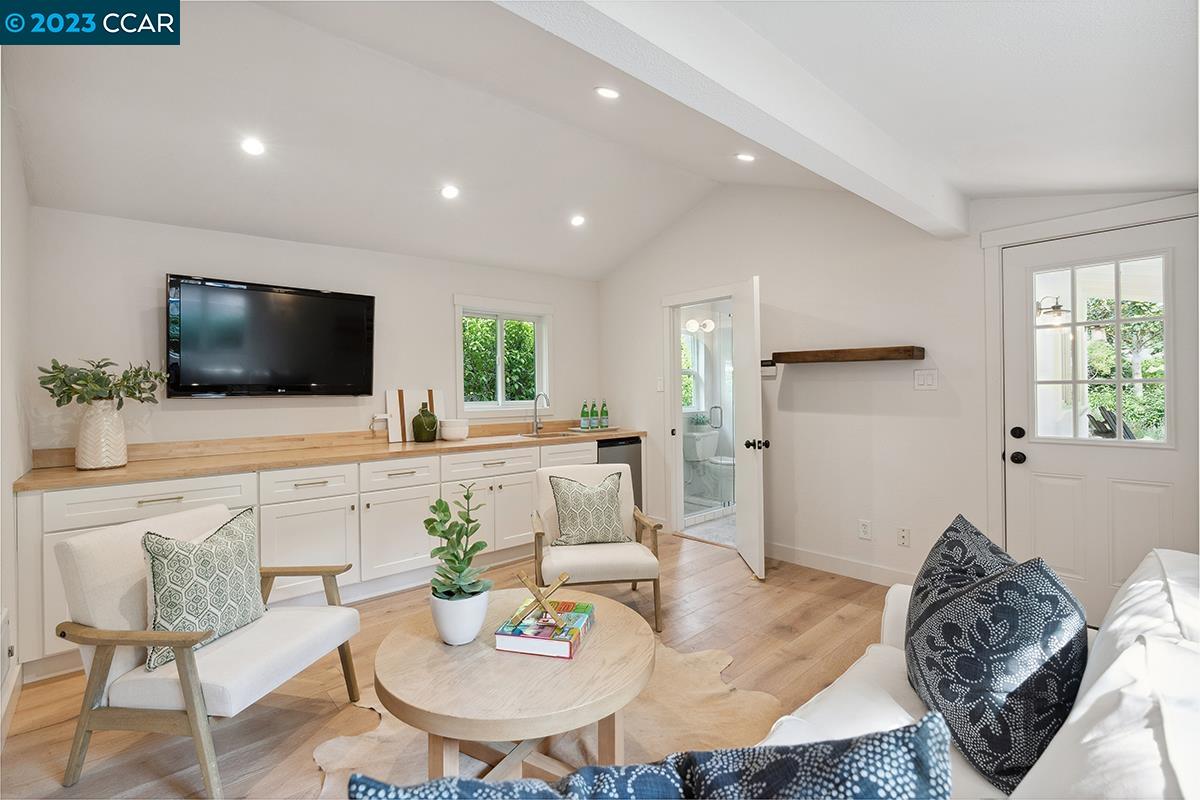 Undisclosed Address Orinda, CA 94563 - Photo 43 of 53 a living room with furniture and a flat screen tv