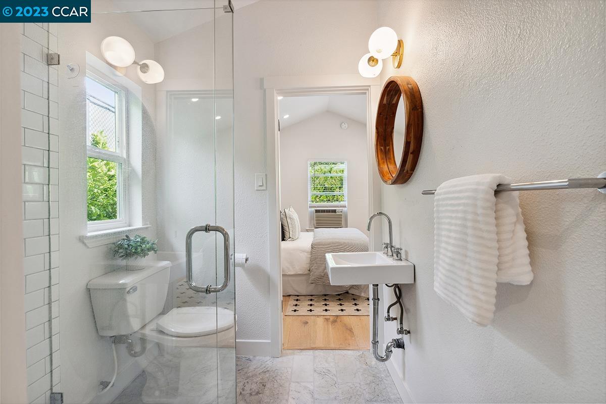 Undisclosed Address Orinda, CA 94563 - Photo 44 of 53 a bathroom with a toilet sink and mirror