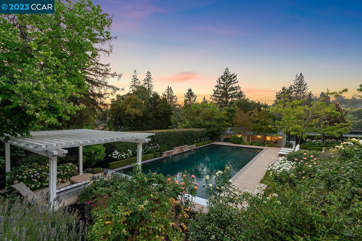 Undisclosed Address Orinda, CA 94563 - Photo 50 of 53 a view of a swimming pool with a yard