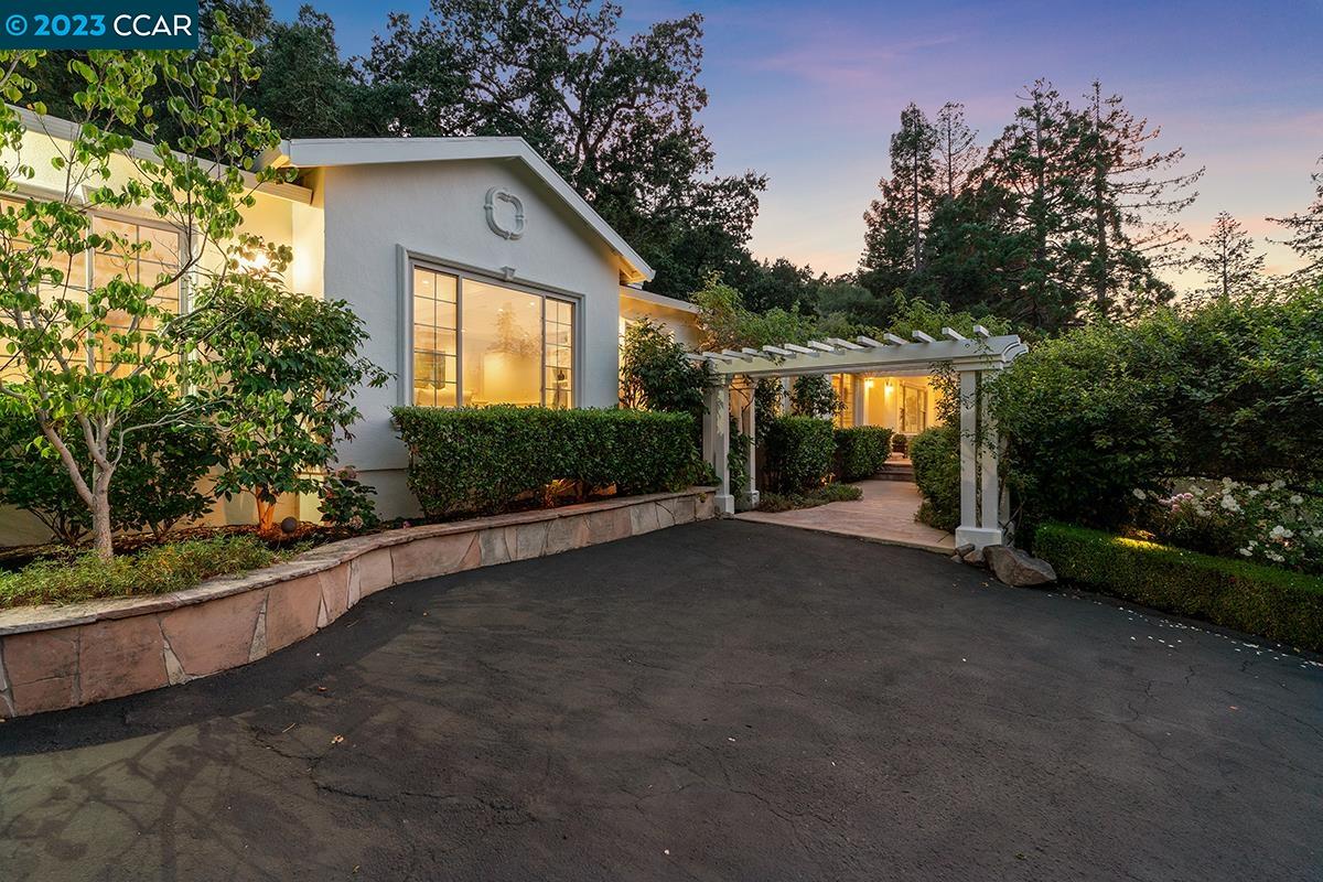 Undisclosed Address Orinda, CA 94563 - Photo 6 of 53 a front view of a house with garden