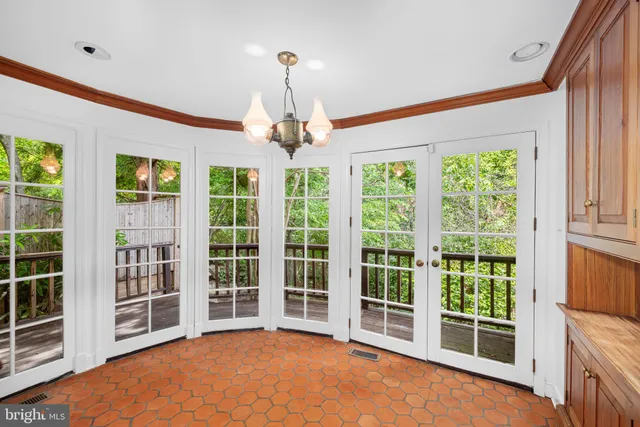 a view of an empty room with windows
