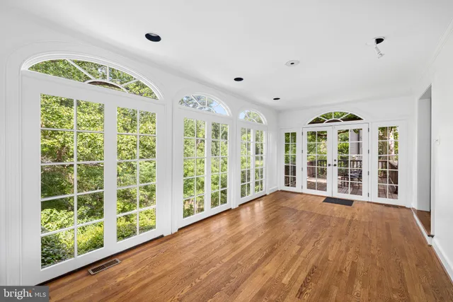 a view of an entryway with wooden floor