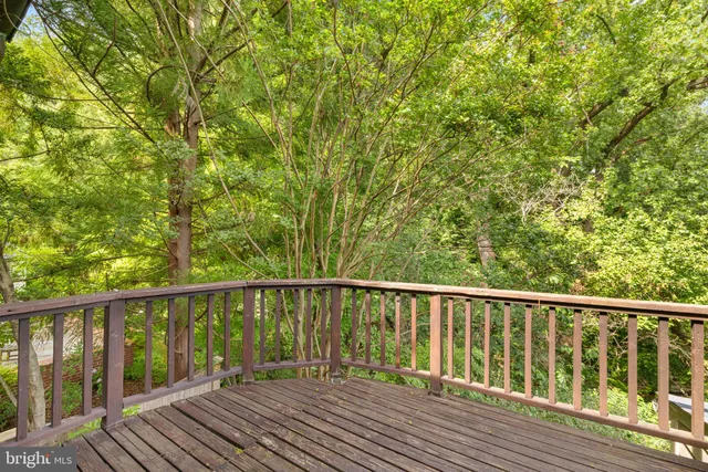 a view of balcony with wooden floor