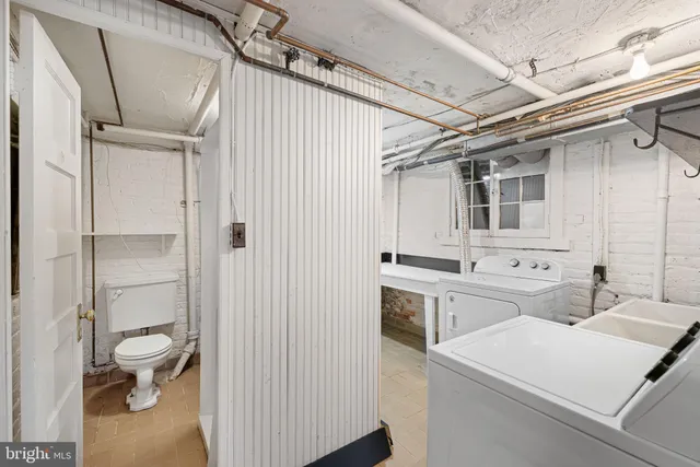 a utility room with dryer and washer