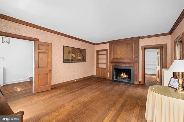a view of a livingroom with an empty space and a fireplace