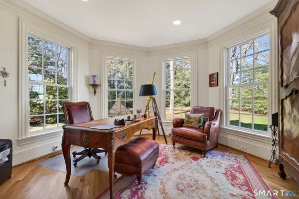 a view of entryway with wooden floor