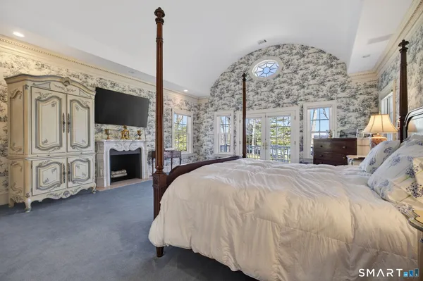 a spacious bathroom with a large tub and large window