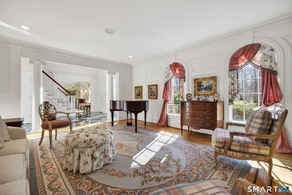 a living room with furniture rug and window