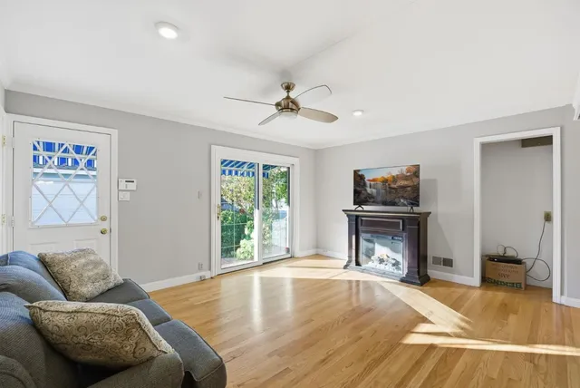 a bathroom with a granite countertop sink mirror and shower