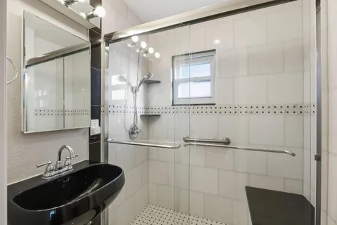 a view of a kitchen with a sink and a fireplace