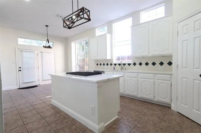 a view of a kitchen with electric appliances