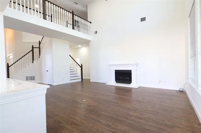 a view of an entryway with wooden floor