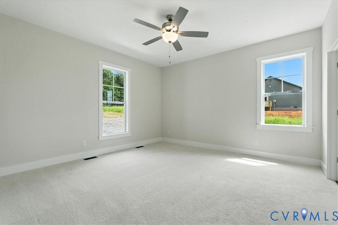 3898 Horseshoe Road Appomattox, VA 24522 - Photo 19 of 32 an empty room with windows and fan