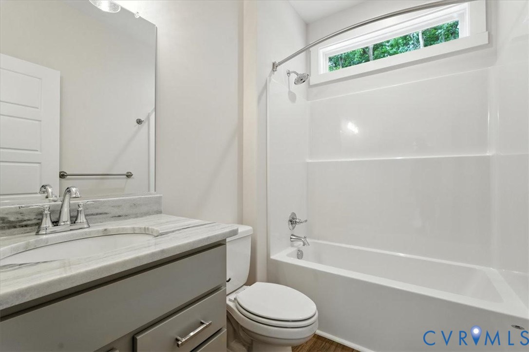 3898 Horseshoe Road Appomattox, VA 24522 - Photo 30 of 32 a bathroom with a sink a toilet and a bathtub