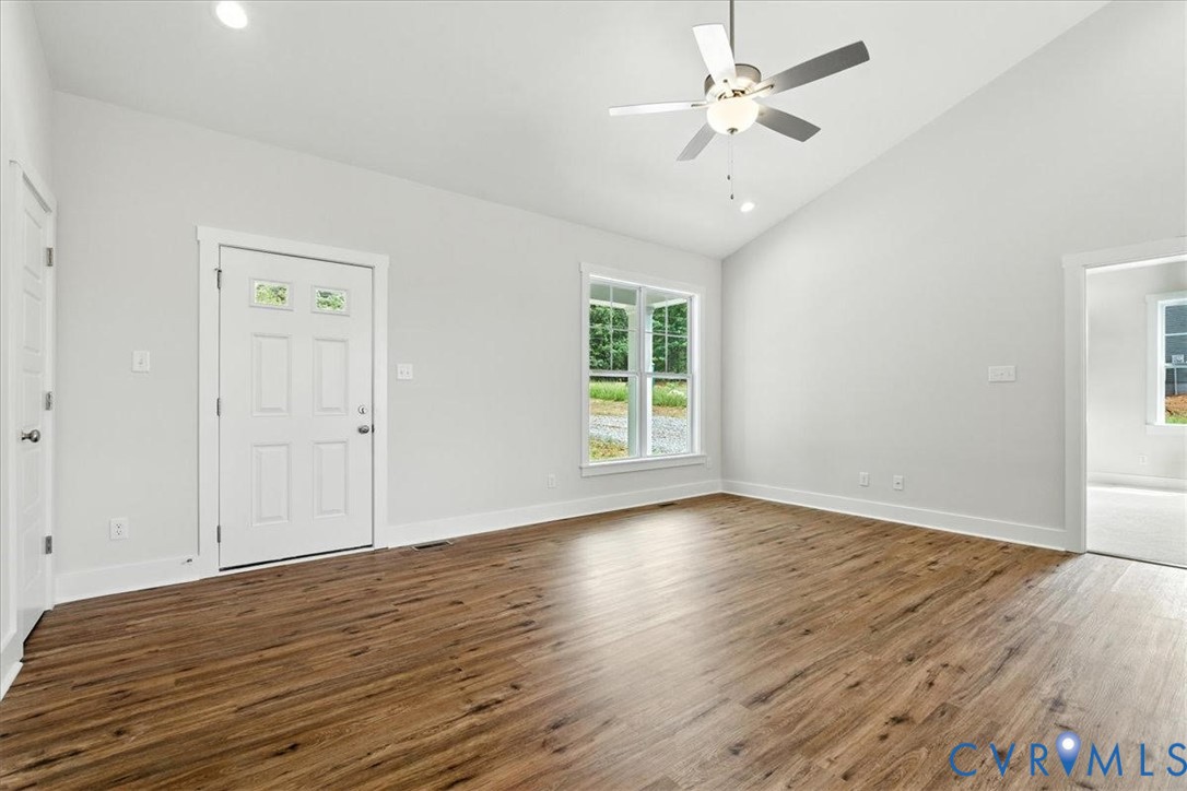 3898 Horseshoe Road Appomattox, VA 24522 - Photo 8 of 32 wooden floor in an empty room with a window