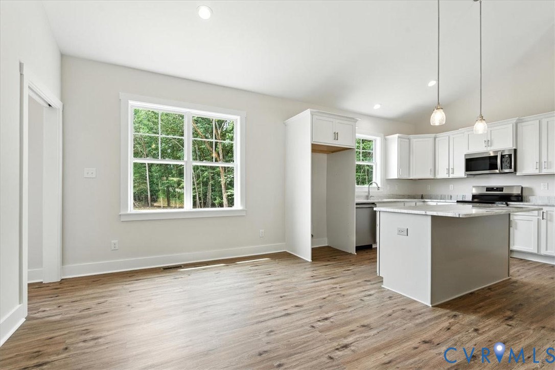3898 Horseshoe Road Appomattox, VA 24522 - Photo 10 of 32 a kitchen with stainless steel appliances granite countertop a refrigerator sink and microwave