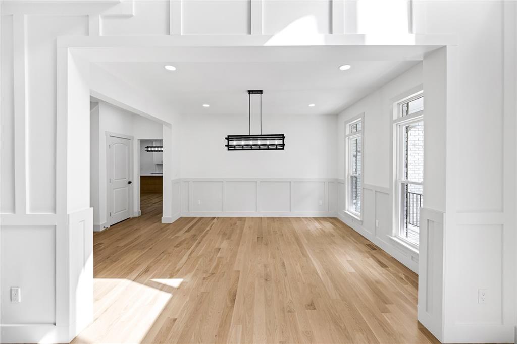 1749 Patriots Way Northwest Kennesaw, GA 30152 - Photo 12 of 54 a view of a room with wooden floor table and a window