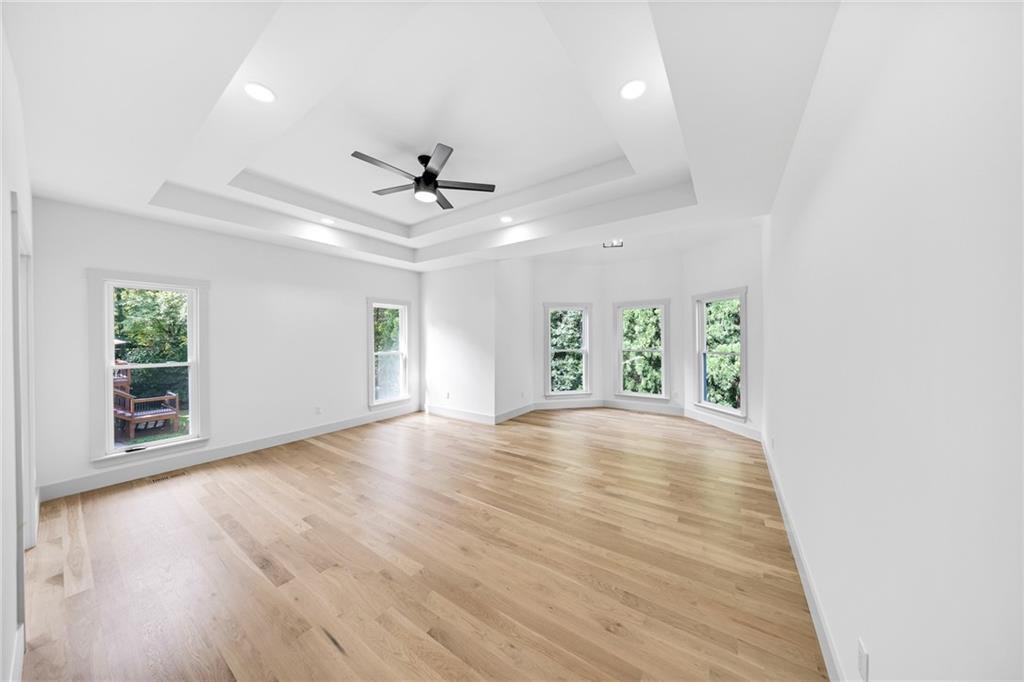1749 Patriots Way Northwest Kennesaw, GA 30152 - Photo 23 of 54 an empty room with wooden floor and windows