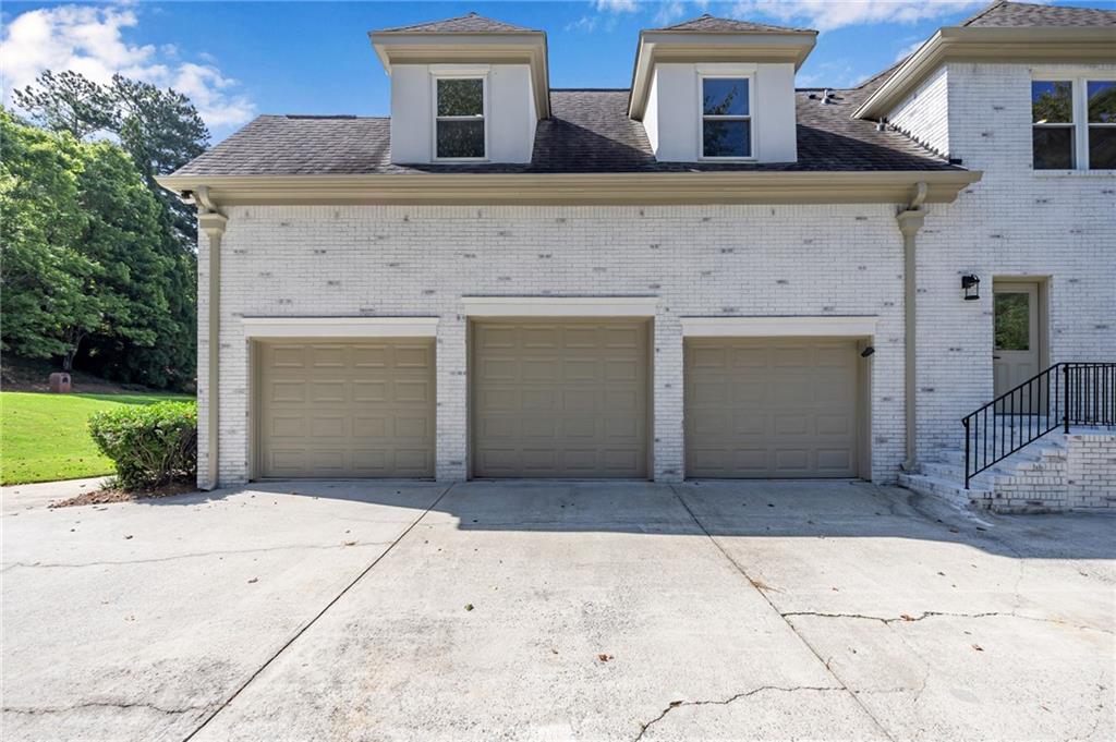 1749 Patriots Way Northwest Kennesaw, GA 30152 - Photo 3 of 54 a front view of a house with yard