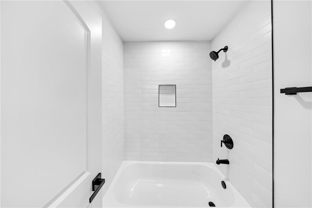 1749 Patriots Way Northwest Kennesaw, GA 30152 - Photo 34 of 54 a bathroom with a bathtub