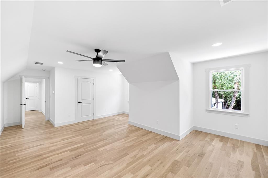 1749 Patriots Way Northwest Kennesaw, GA 30152 - Photo 35 of 54 wooden floor in an empty room with a window