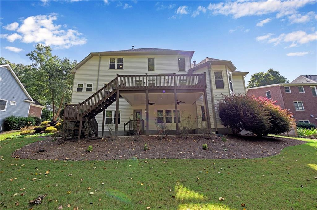 1749 Patriots Way Northwest Kennesaw, GA 30152 - Photo 4 of 54 a front view of a house with a yard