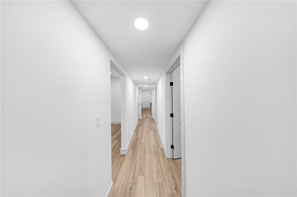1749 Patriots Way Northwest Kennesaw, GA 30152 - Photo 45 of 54 a view of a hallway with wooden floor