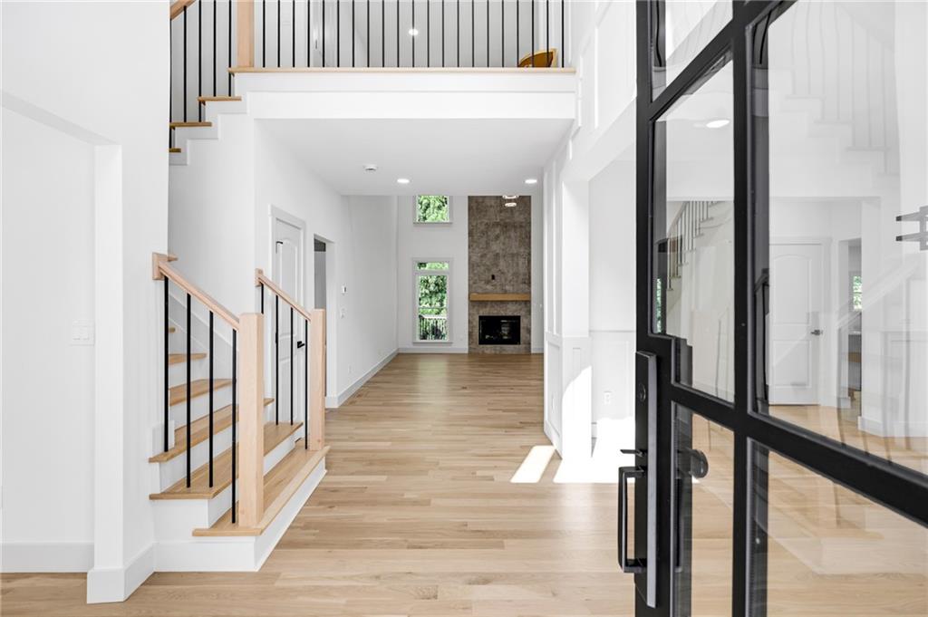 1749 Patriots Way Northwest Kennesaw, GA 30152 - Photo 10 of 54 a view of a hallway with wooden floor and staircase