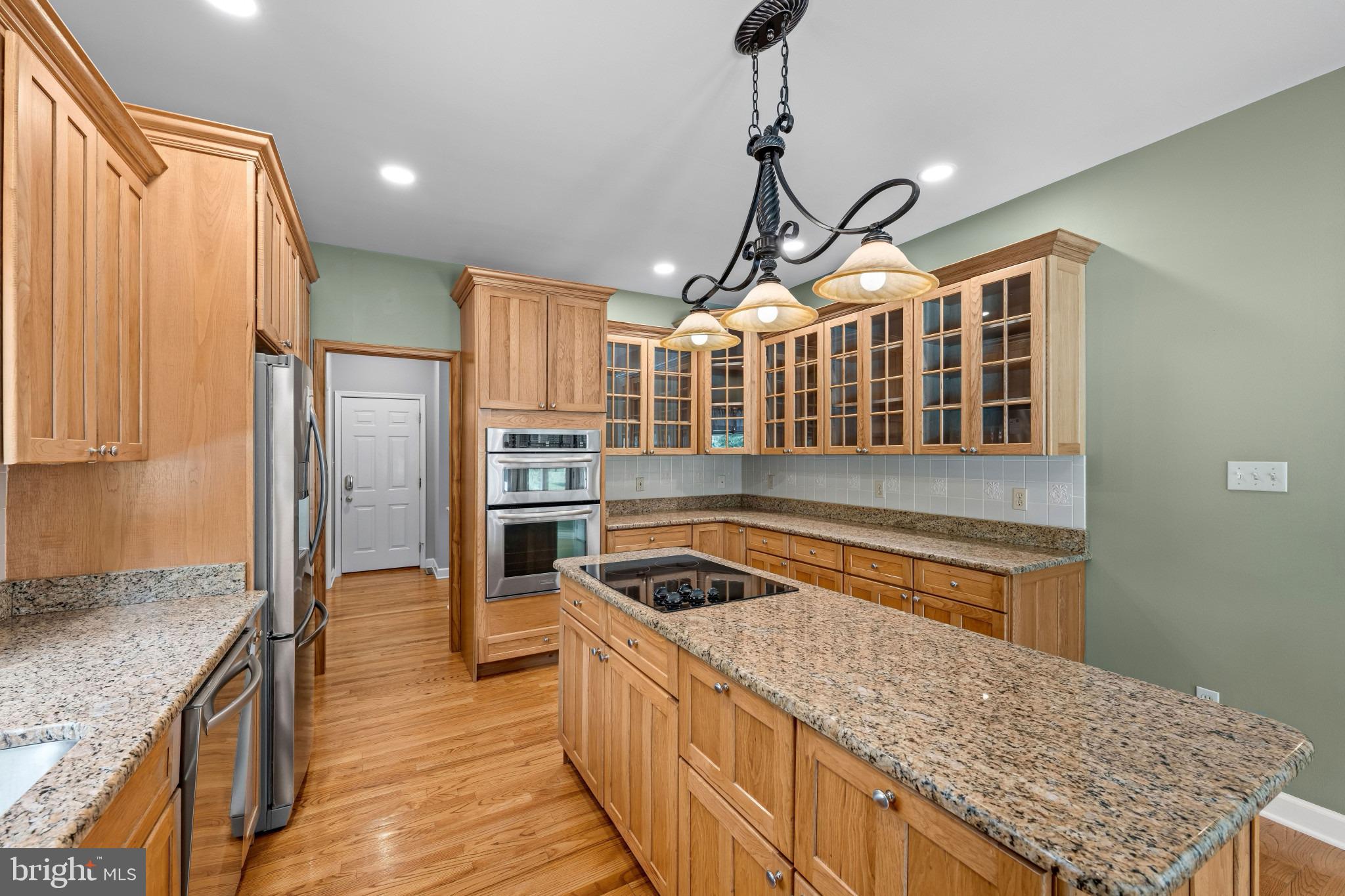 113 Bentons Pleasure Road Chester, MD 21619 - Photo 21 of 53 Elegant kitchen with warm wood accents.