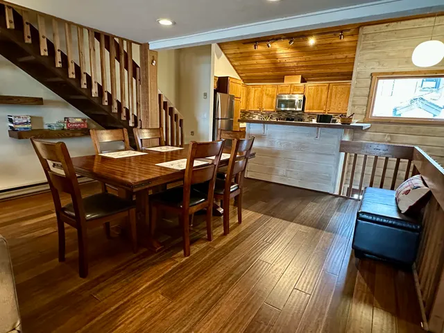 a kitchen with a refrigerator and a sink