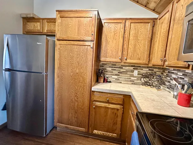 a kitchen with a sink cabinets and stainless steel appliances