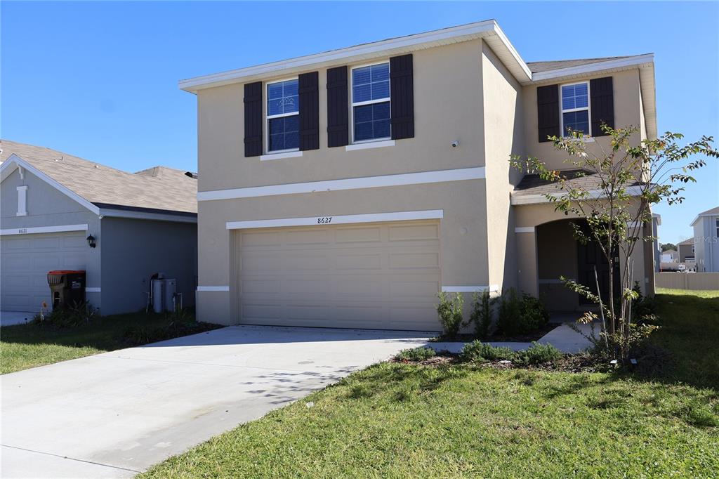 8627 Southwest 45th Court Ocala, FL 34476 - Photo 12 of 39 a front view of a house with a yard