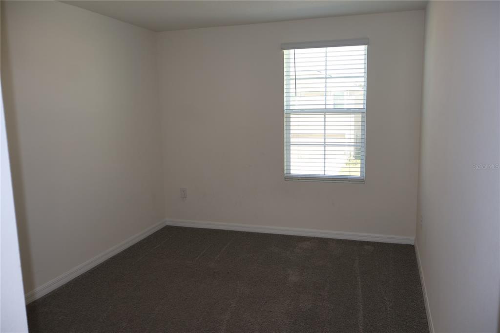 8627 Southwest 45th Court Ocala, FL 34476 - Photo 18 of 39 an empty room with a window