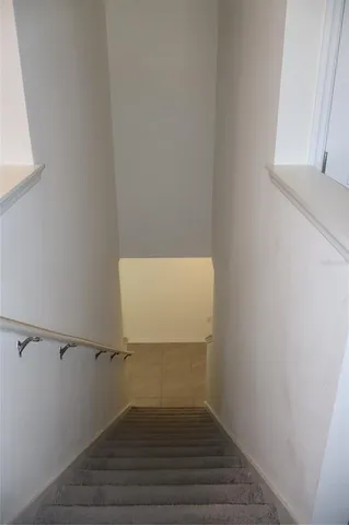 a view of small space with wooden floor and window