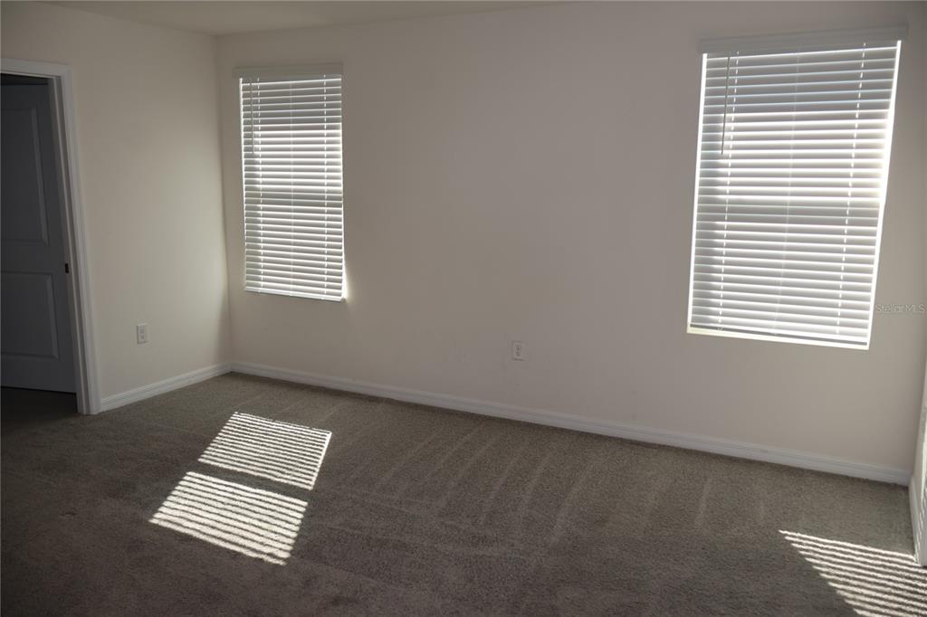 8627 Southwest 45th Court Ocala, FL 34476 - Photo 21 of 39 a view of an empty room with a window