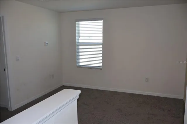 a view of a room that has a window in it