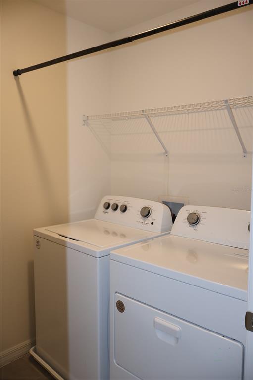8627 Southwest 45th Court Ocala, FL 34476 - Photo 29 of 39 a utility room with dryer and washer