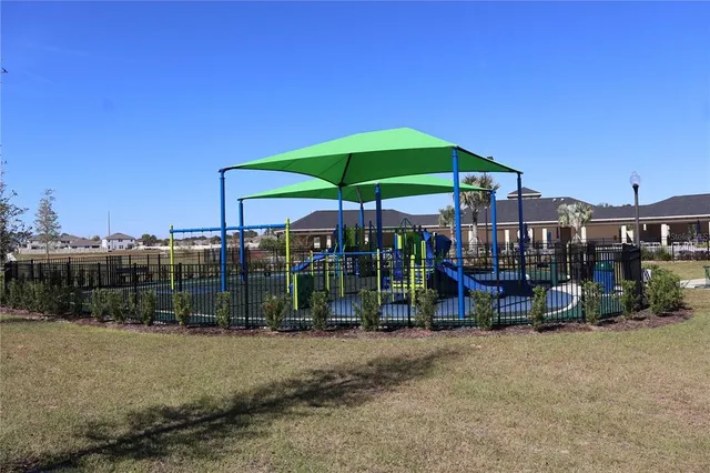a view of a chairs and table in backyard