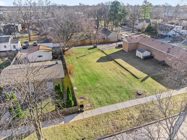 a view of a backyard with swimming pool