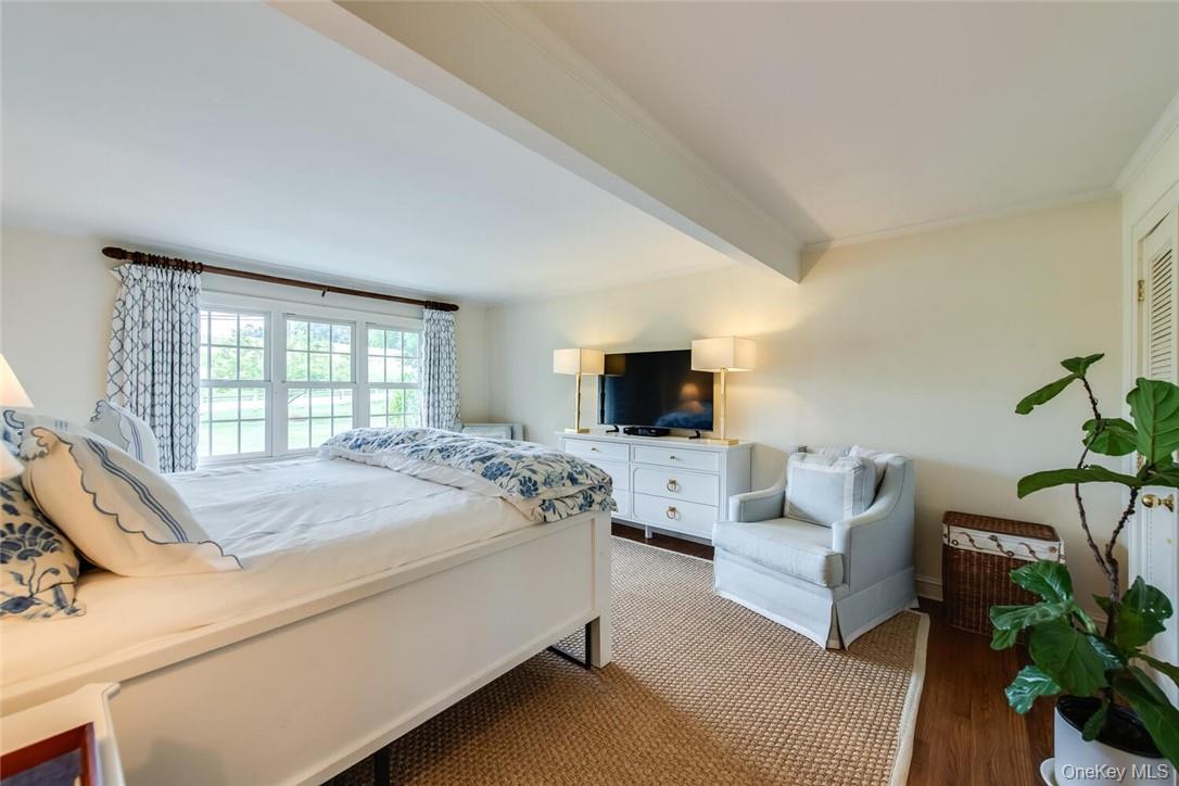 247 North Mabbettsville Road Millbrook, NY 12545 - Photo 12 of 25 a bed room with furniture and a flat screen tv