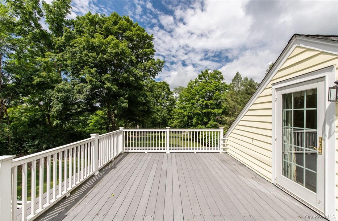 247 North Mabbettsville Road Millbrook, NY 12545 - Photo 16 of 25 a view of a wooden balcony with trees