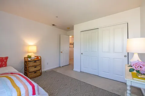 a bed room with a bed and a couch